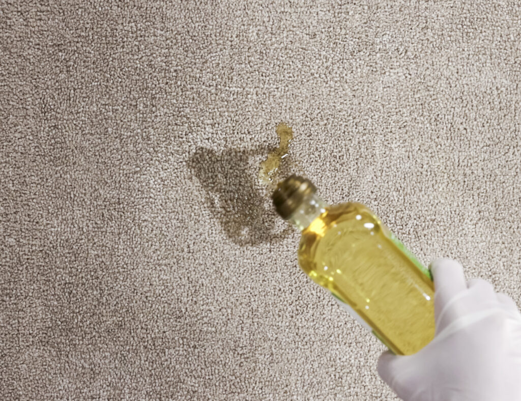 Pouring olive oil into carpet