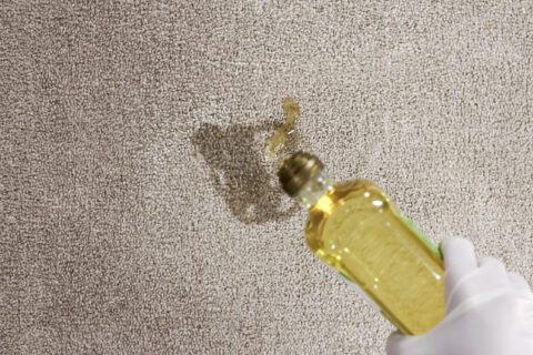 Pouring olive oil into carpet